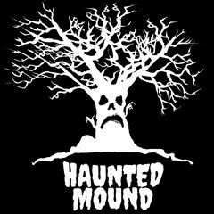 a white tree with a creepy face on it's head and the words, haunted mound