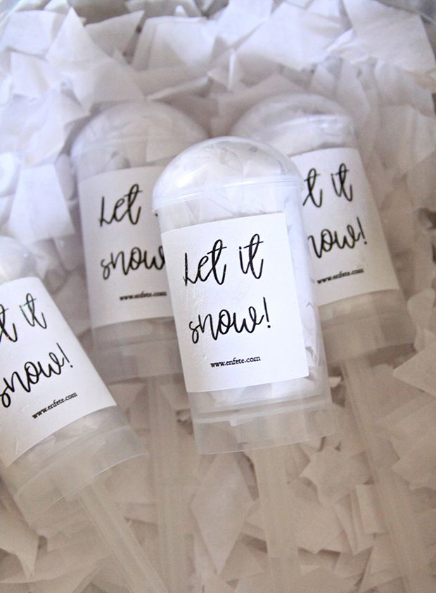 three empty plastic cups sitting on top of shredded paper with words written in black ink