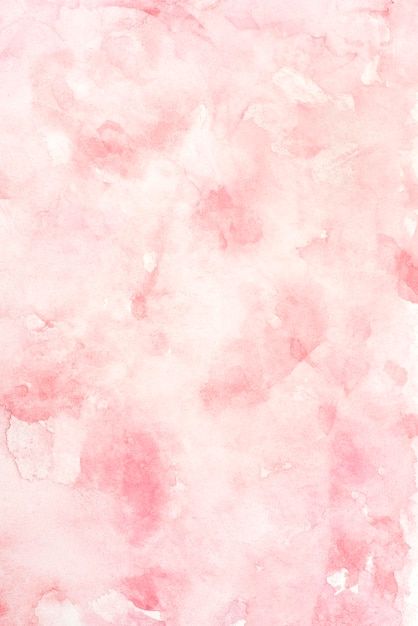 a pink and white background with some watercolor stains on it's paper,