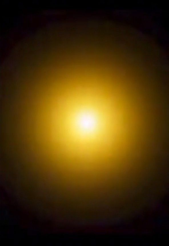 the bright light is shining brightly in the dark night sky, and it appears to be yellow