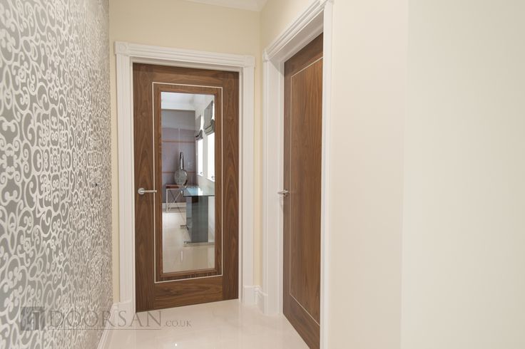 the hallway is clean and ready to be used as an entrance way for someone's home