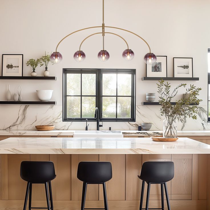 a kitchen with marble counter tops and bar stools in front of an open window