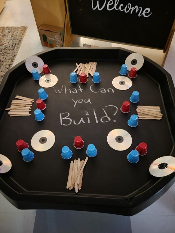 a black tray with red, white and blue items on it that says welcome what can you build?