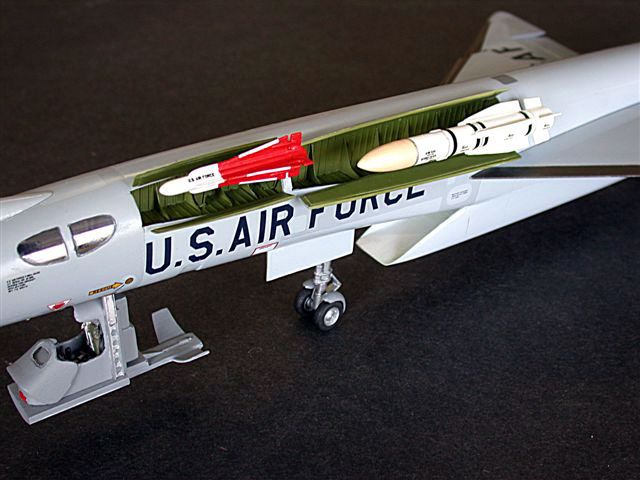 a model airplane is sitting on a black surface with the words u s air force painted on it