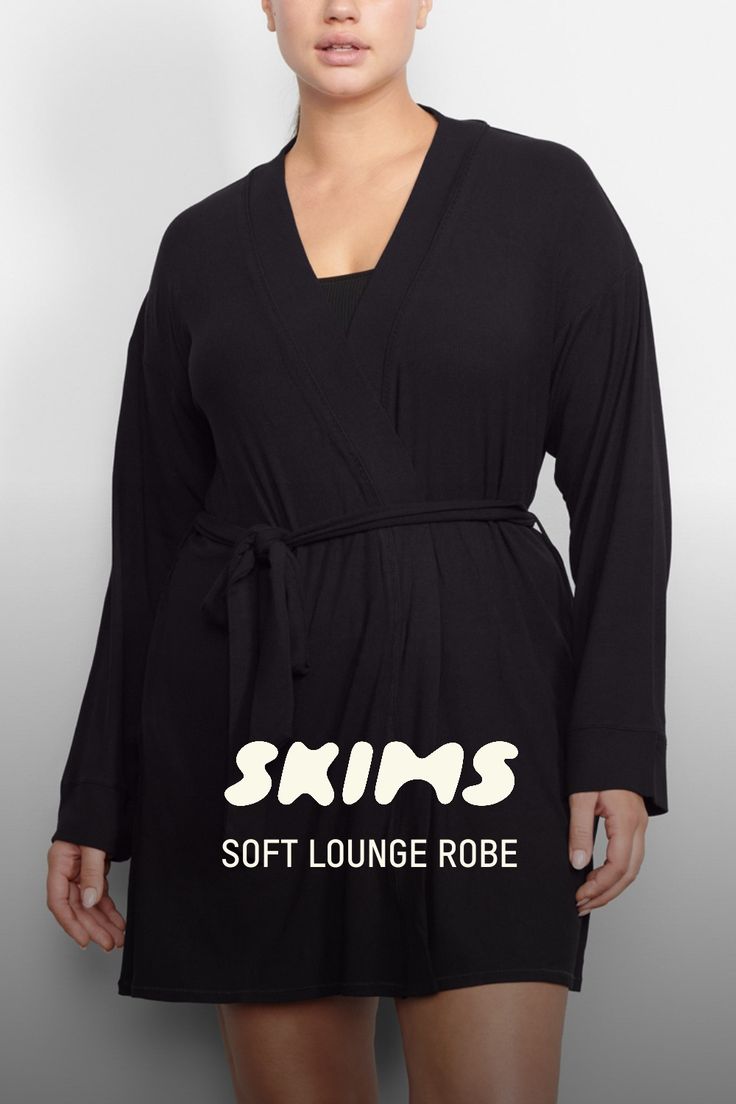 Perfect for lounging and layering over sleepwear, the Soft Lounge Robe is composed of super-soft modal ribbed fabric that drapes effortlessly in all the right places. This short robe features an adjustable self-tie belt and functional side pocket at inseam. | SKIMS Robe | Black | XS | Soft Lounge V-neck Robe With Tie Waist For Loungewear, Fitted Solid Sleepwear For Lounging, Fitted Robe For Loungewear In Fall, Fitted Solid Color Sleepwear For Lounging, Fitted Fall Robe For Loungewear, Fitted Fall Loungewear Robe, Solid Color Long Sleeve Robe For Loungewear, Spring Lounging Wrap Sleepwear, Fitted Long Sleeve Robe For Loungewear