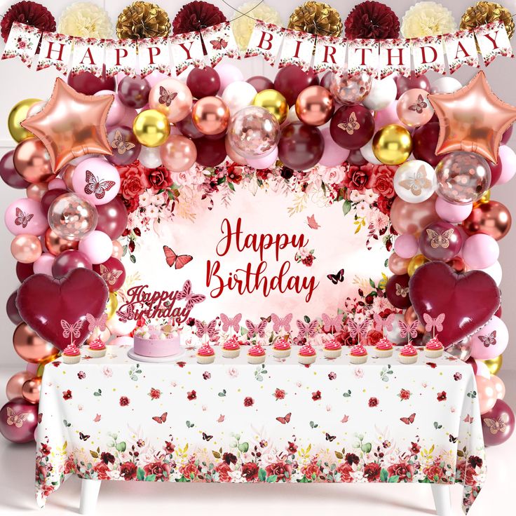 a happy birthday card with balloons and hearts on the table in front of a backdrop