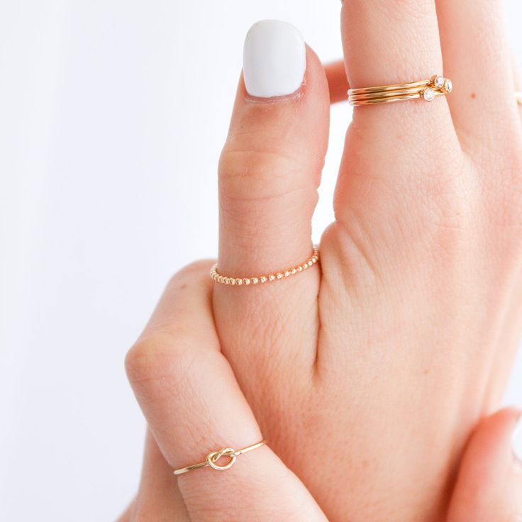 Dainty and delicate, the Love Me Knot Ring is one of the sweetest additions to our stacking kellection. Made to remember the ties to our loved ones, this beauty is the perfect gift for the special someone in your life or to permanently have your nearest and dearest close at hand. Simple Stacking Rings, Rectangle Necklace, June Birthday, Oval Necklace, Symbol Necklace, Knot Ring, Ring Simple, Zodiac Necklaces, Bar Necklace