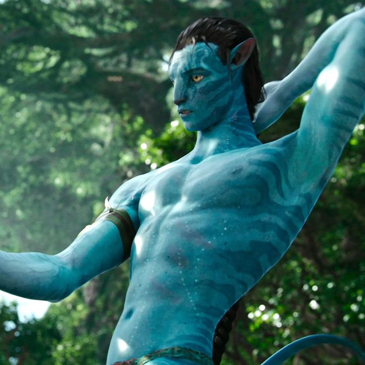 a man dressed as avatar from avatar is holding a tennis racket in his hand