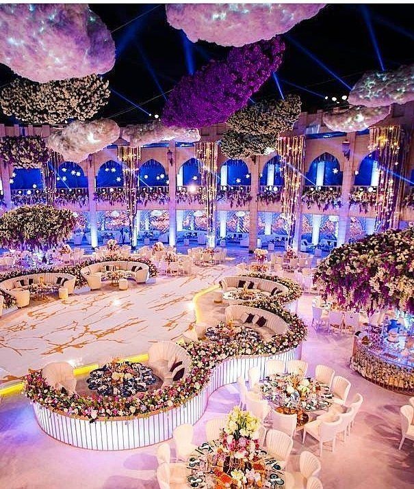 an elaborately decorated banquet hall with tables and chairs