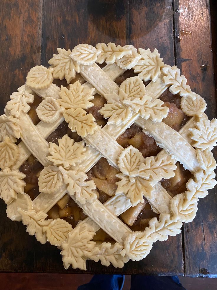 a pie sitting on top of a wooden table