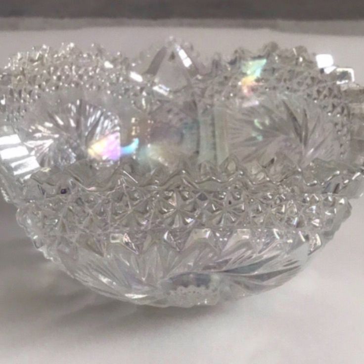 a glass bowl sitting on top of a table