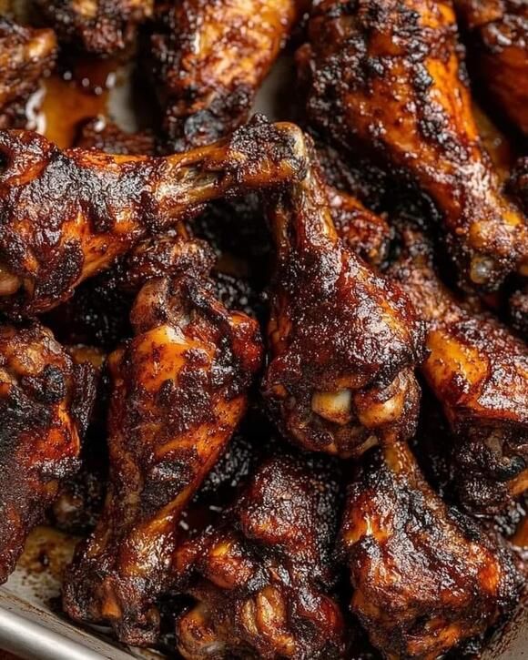 closeup of chicken wings in a frying pan