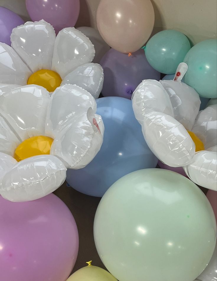 balloons and flowers are scattered on the floor