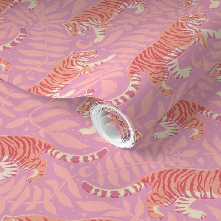 a pink and orange tiger wallpaper with white stripes on it's face, next to a roll of tape