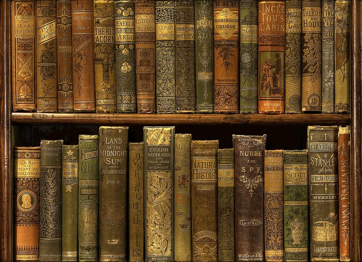 an old book shelf filled with lots of brown and green books on top of each other