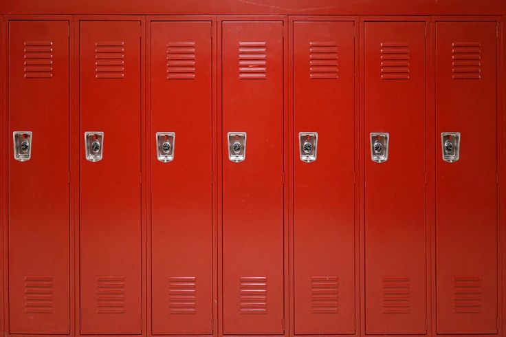 a row of red lockers sitting next to each other