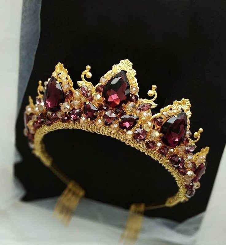 Luxurious wedding tiara with crystal rhinestones. Burgundy tiara entirely handmade, made of metal elements, crystal rhinestones, crystal and pearl beads. An ideal addition to the red crown will be beautiful earrings that are made of identical materials. Ruby wedding band height - 2.35 inches.  The ruby crown is light, despite the size. Burgundy and gold set. This set of accessories is made of thin metal elements, crystal rhinestones and beads.  The length of the decorative part of the ruby necklace is about 7.5 inches, the total length with the chain is 15 inches (2 inches of the extension chain).  If you need to increase the length of the chain - let me know (it's free) The length of the ruby earrings is 2.35 inches. The ruby bracelet is about 1.35 inches wide, 7 inches long (can be adjus Red And Gold Crown, Gold Tiara Wedding, Ruby Tiara, Ruby Crown, Burgundy Crown, Red Tiara, Bridal Crown Crystal, Tiara Gold, Ruby Wedding Band