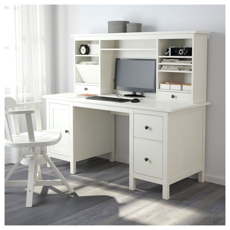 a white desk with a computer on top of it