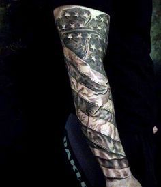 a man's arm with an american flag and eagle tattoo on his left arm