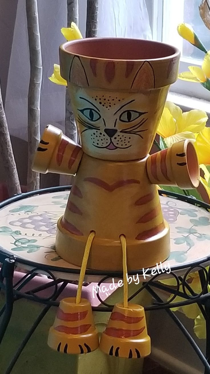 a cat planter sitting on top of a table