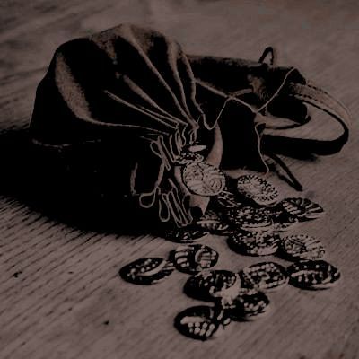 a drawstring bag sitting on top of a wooden floor next to some coins