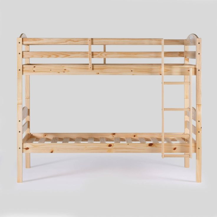 a wooden bunk bed sitting on top of a white floor