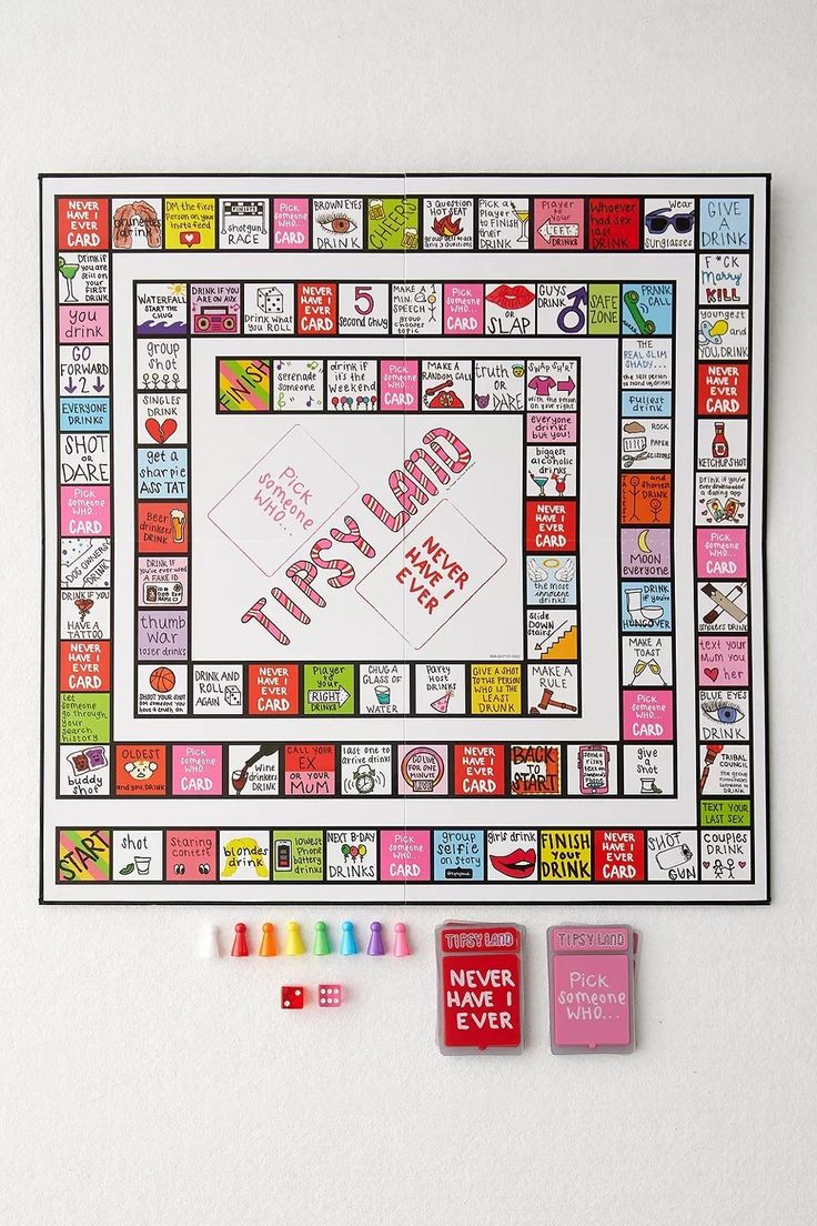 a board game with words on it next to some crayons and colored markers