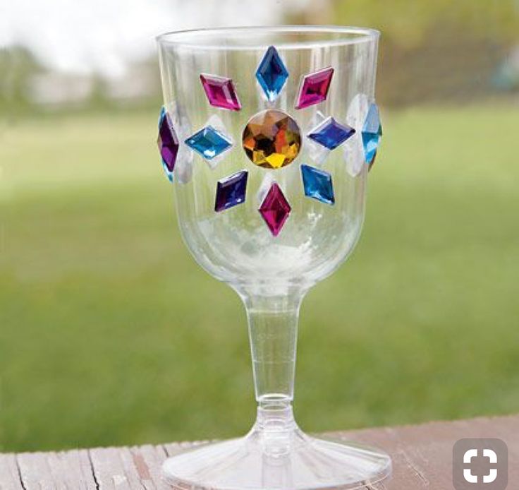 a wine glass sitting on top of a wooden table