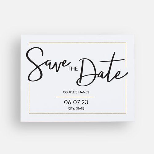 save the date card with black ink on white paper and gold foil lettering, in front of a gray background