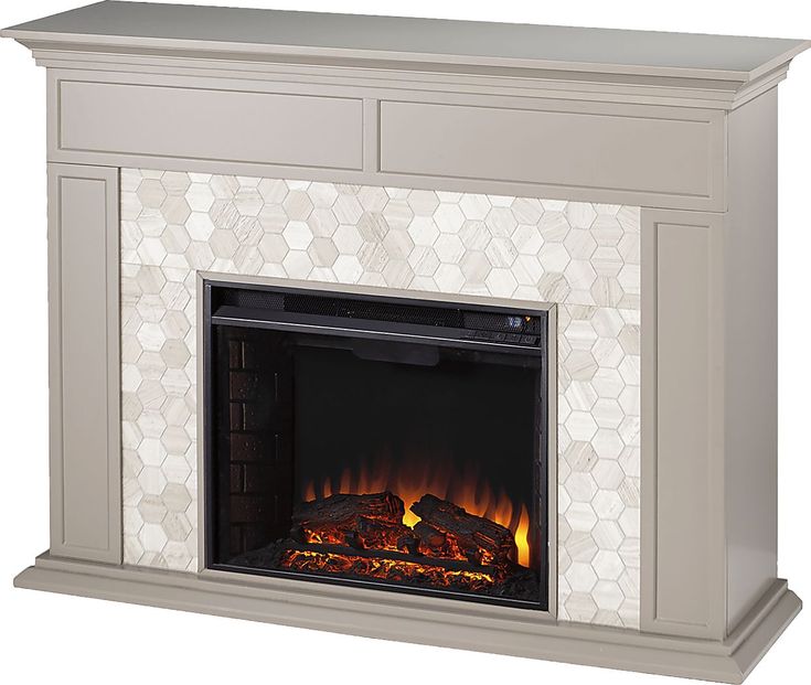 a white fireplace with an open fire place in the center and hexagonal tiles on it