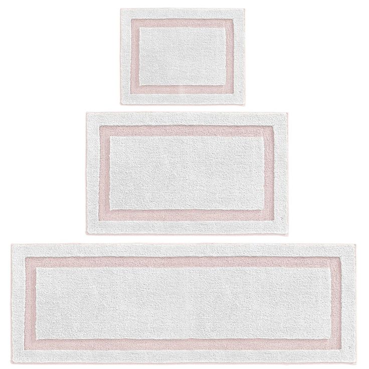 two white towels with pink borders on top of each other in front of a white background