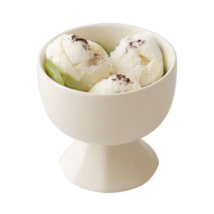 three scoops of ice cream in a white bowl