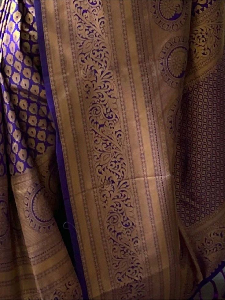 Get simplicity and grace with this mystic purple kanjivaram silk trendy saree. The brilliant attire creates a dramatic canvas with amazing weaving used in this handloom work with small motifs all over the saree and jacquard weaving border work. This lovely kanjivaram silk purple color saree is paired with a similar color blouse in silk material with zari border work. This pretty purple woven silk festival wear saree is 5.50 meters long and comes with 1.00 mtr blouse material. Celebrate your upco Purple Motif Sharara With Traditional Drape, Purple Motifs Sharara With Traditional Drape, Purple Motifs Traditional Drape Sharara, Purple Sharara With Motifs In Traditional Drape, Purple Blouse Piece With Traditional Patterns For Festivals, Purple Choli With Zari Weaving For Navratri, Festival Traditional Purple Blouse Piece, Purple Blouse For Diwali And Traditional Ceremonies, Festival Purple Blouse Piece With Traditional Patterns