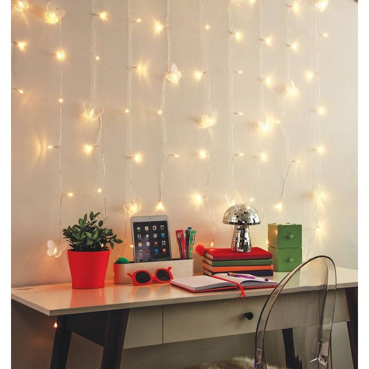 a desk with some books and lights on it