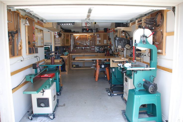 the inside of a garage with many different tools on tables and workbenches in it