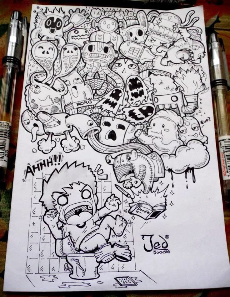 a bunch of cartoon characters drawn on top of a piece of paper with marker pens