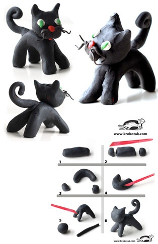 the black cat has green eyes and is ready to play with his toy figure set