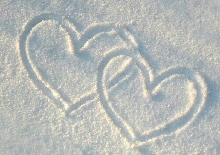 two hearts are drawn in the snow