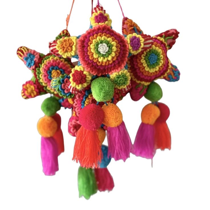 an ornament hanging from the ceiling with tassels