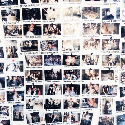 a wall covered in photos and pictures of people on it's side, with words written below them