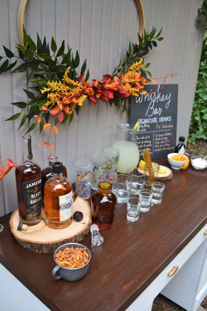 an outdoor bar set up with drinks and snacks for the guests to enjoy on their own