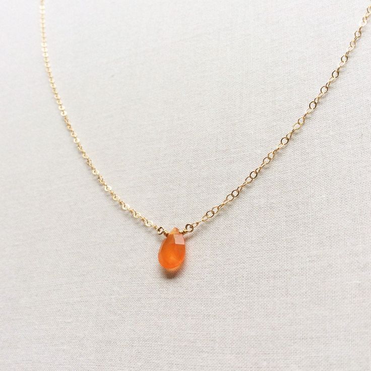 "This Carnelian necklace is made of genuine high quality faceted Carnelian. There are gold filled ,sterling silver and 14kt gold chain you can choose from. There are 2 sizes that you can choose from 16\" or 18\" in gold filled, sterling silver or 14k gold. This tiny carnelian necklace is light weight and elegant. The Carnelian jewelry stone is around 1.5 carats. This tiny carnelian necklace is great for layering with other gold necklaces. This orange stone necklace is delicate and perfect to go Amber Necklaces With Faceted Beads For Gift, Amber Faceted Beads Necklace For Gift, Amber Necklace With Faceted Beads For Gift, Orange Faceted Jewelry Gift, Gift Carnelian Crystal Necklace In Orange, Orange Carnelian Crystal Necklace As Gift, Orange Carnelian Crystal Necklace For Gift, Orange Carnelian Crystal Necklace Gift, Orange Faceted Carnelian Necklaces