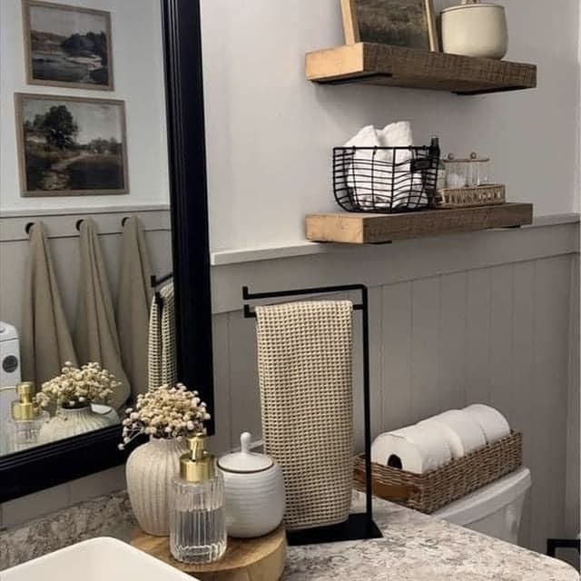 the bathroom is decorated in neutrals and whites