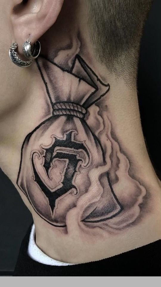 a man's neck with a tattoo on it