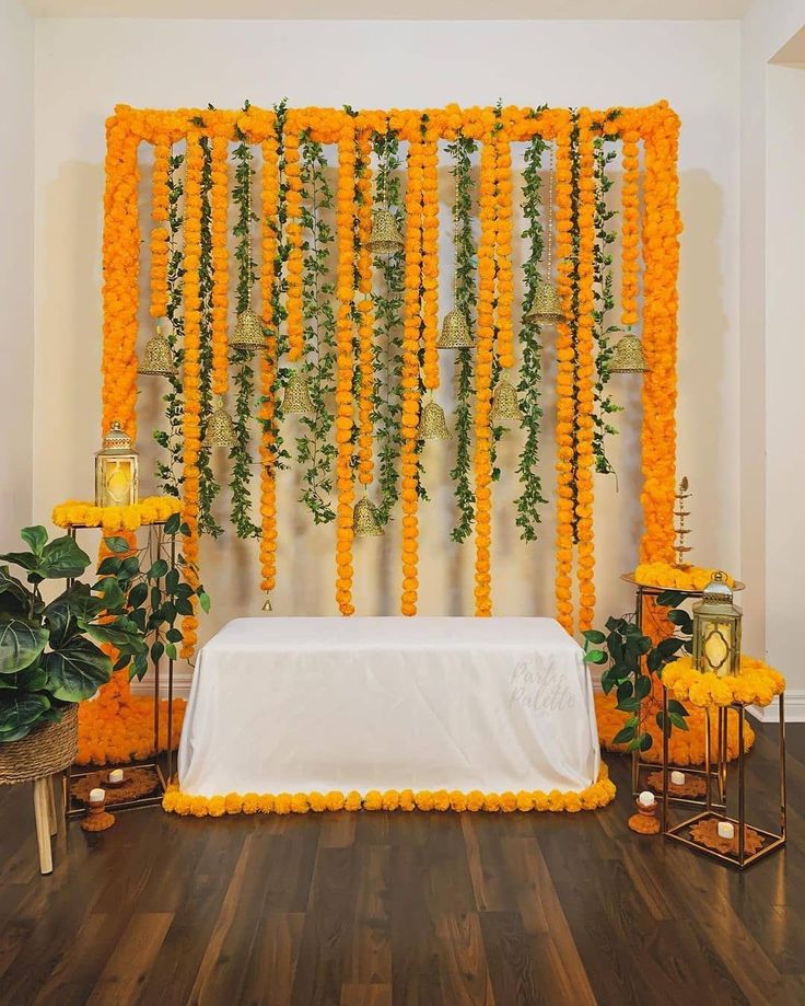 a white table topped with flowers and candles