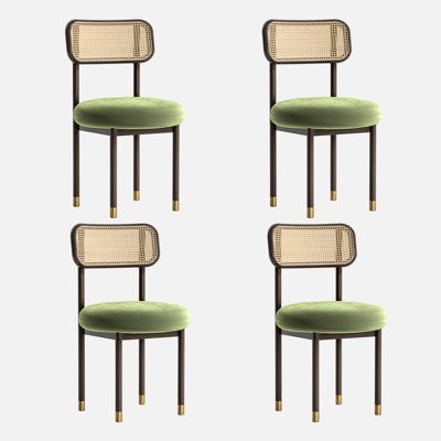 four chairs with green upholstered cushions