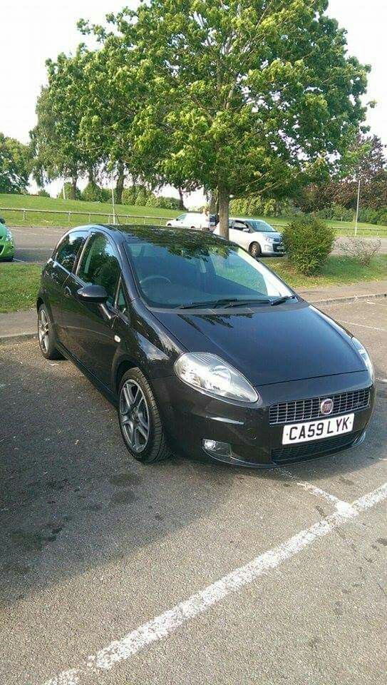 a black car parked in a parking lot