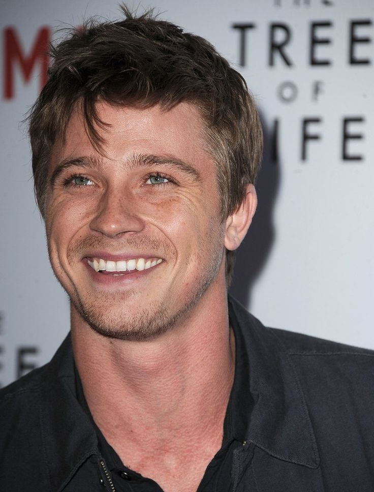 a man smiling and wearing a black shirt at the tree of life screening in los angeles