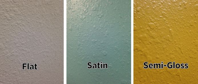 four different colors of paint on the wall and one is white, yellow, green, blue