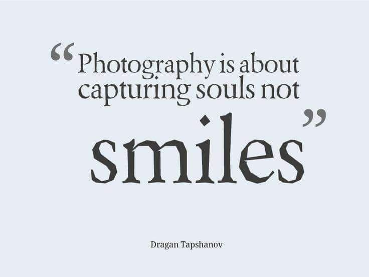 a quote that says photography is about capturing soul's not smiles, written in black on